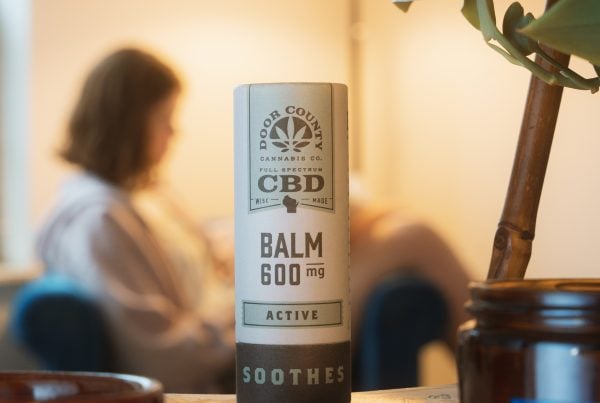 Active CBD Balm in a 2 oz biodegradable container, showcasing natural ingredients for muscle and joint relief.